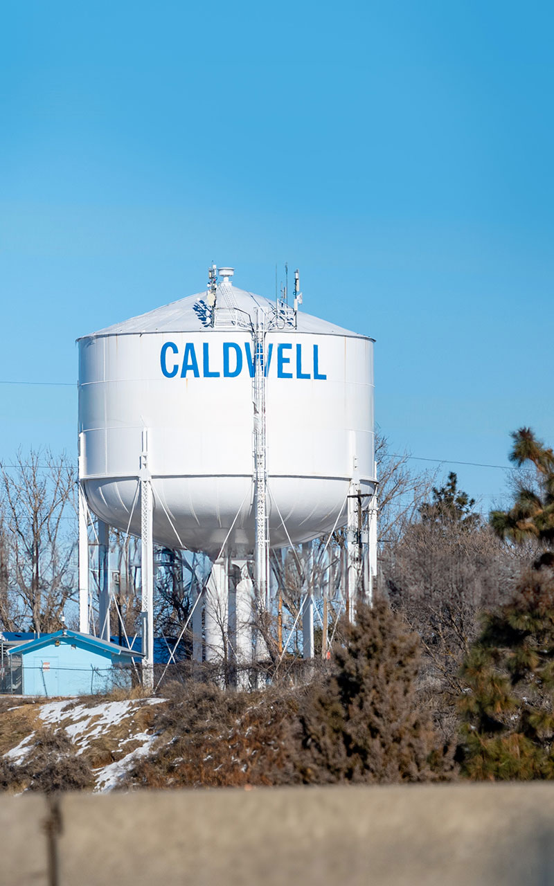 Caldwell Idaho water tower with a bright blue sky