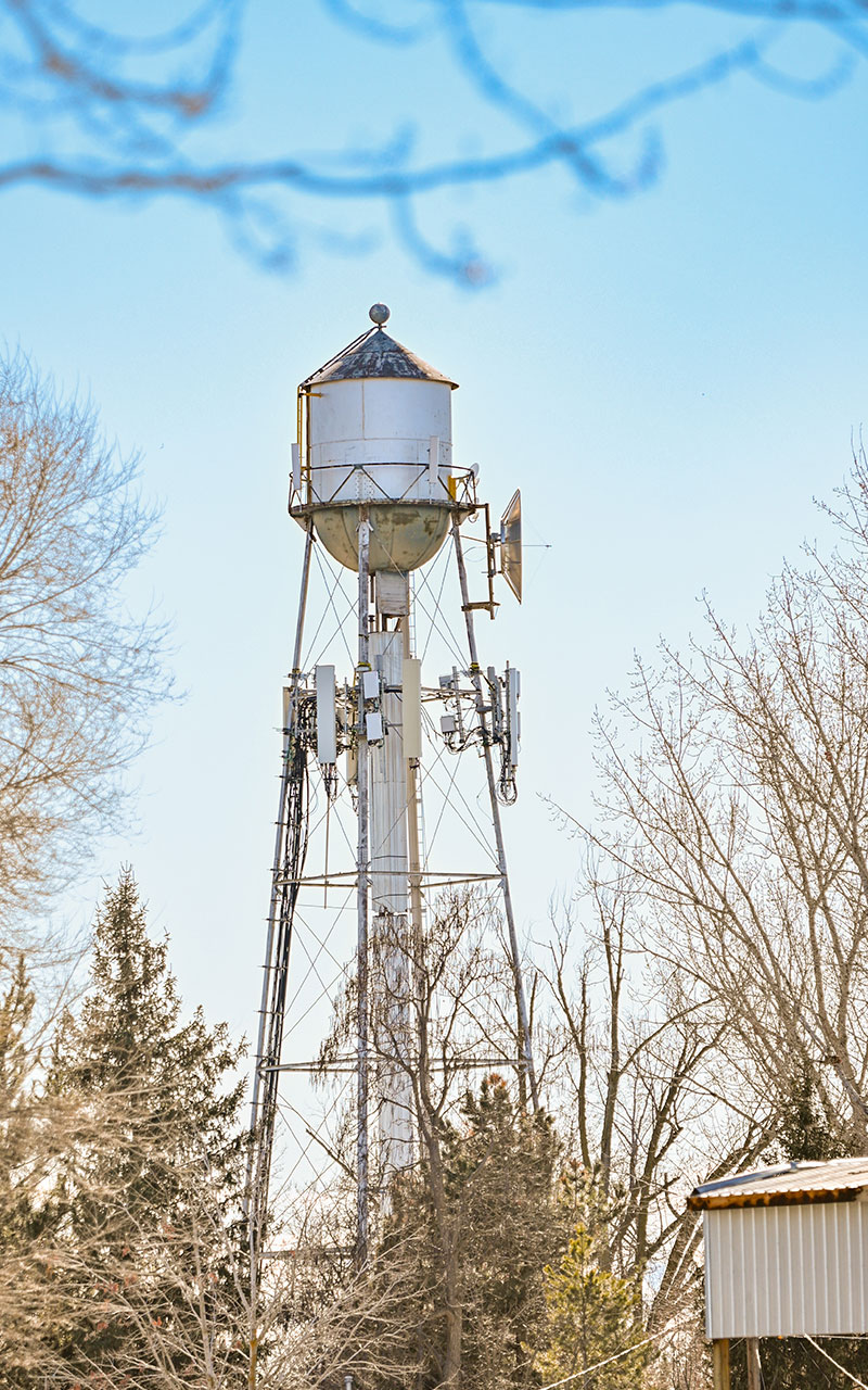 Water tower high above the trees in the city of Middleton.