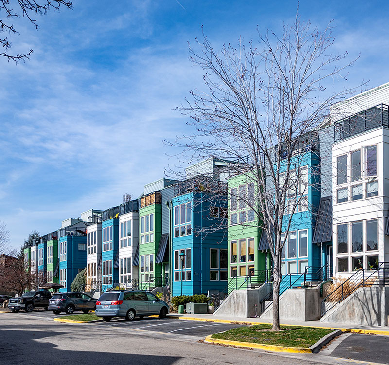 Row of colorful tall homes in Garden City.