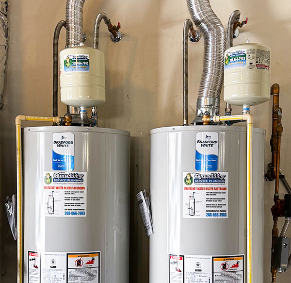 Two water heaters with expansion tanks.