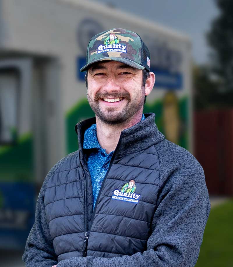 Local Plumber smiling with a hat on.