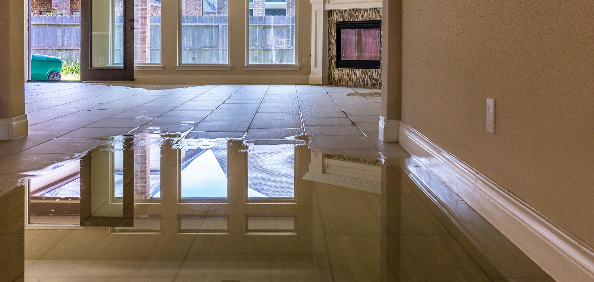 A puddle of water inside the interior of a home.